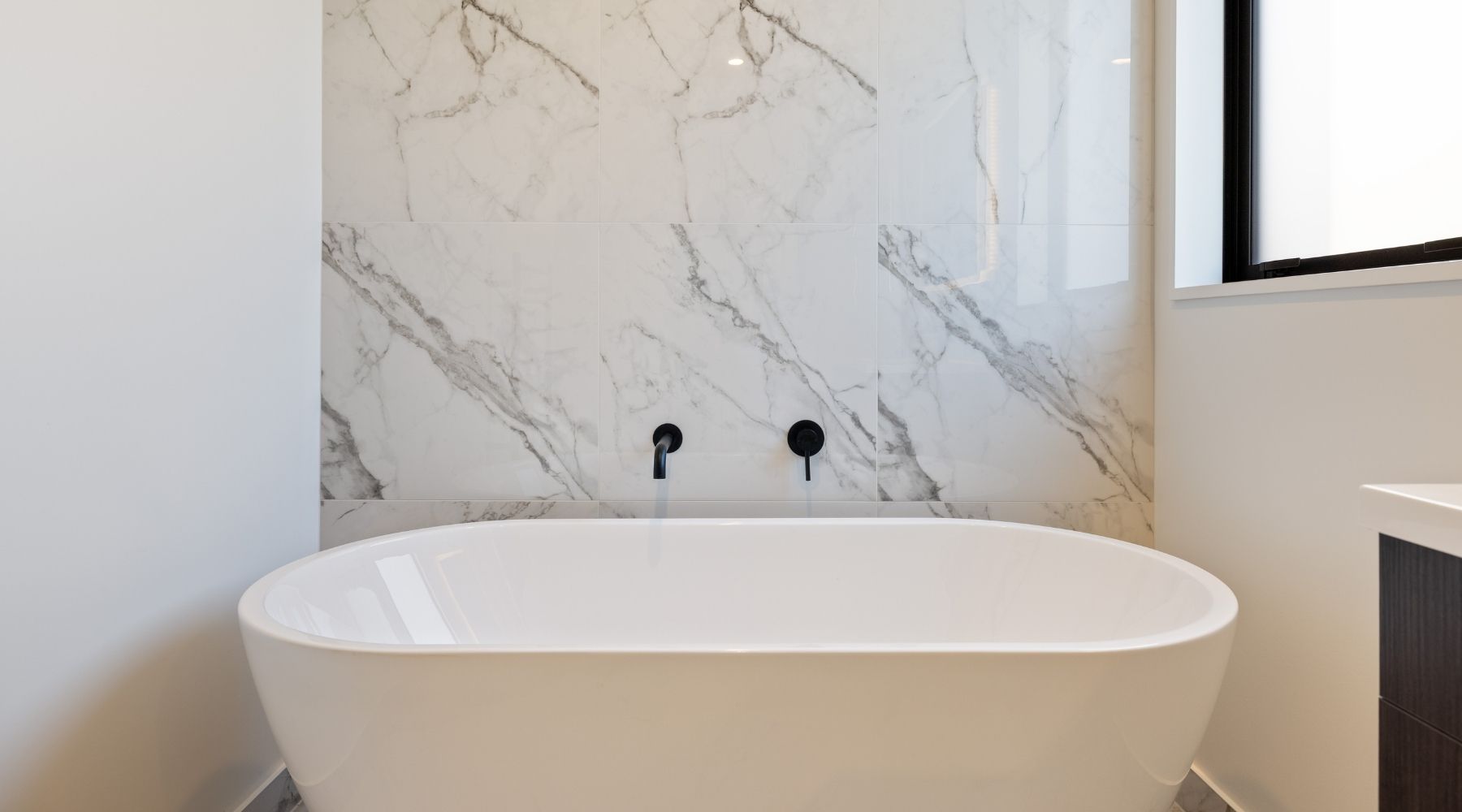 Detail of marble-look tile used in a Hallmark Homes bathroom, part of a luxury custom home design in Christchurch.