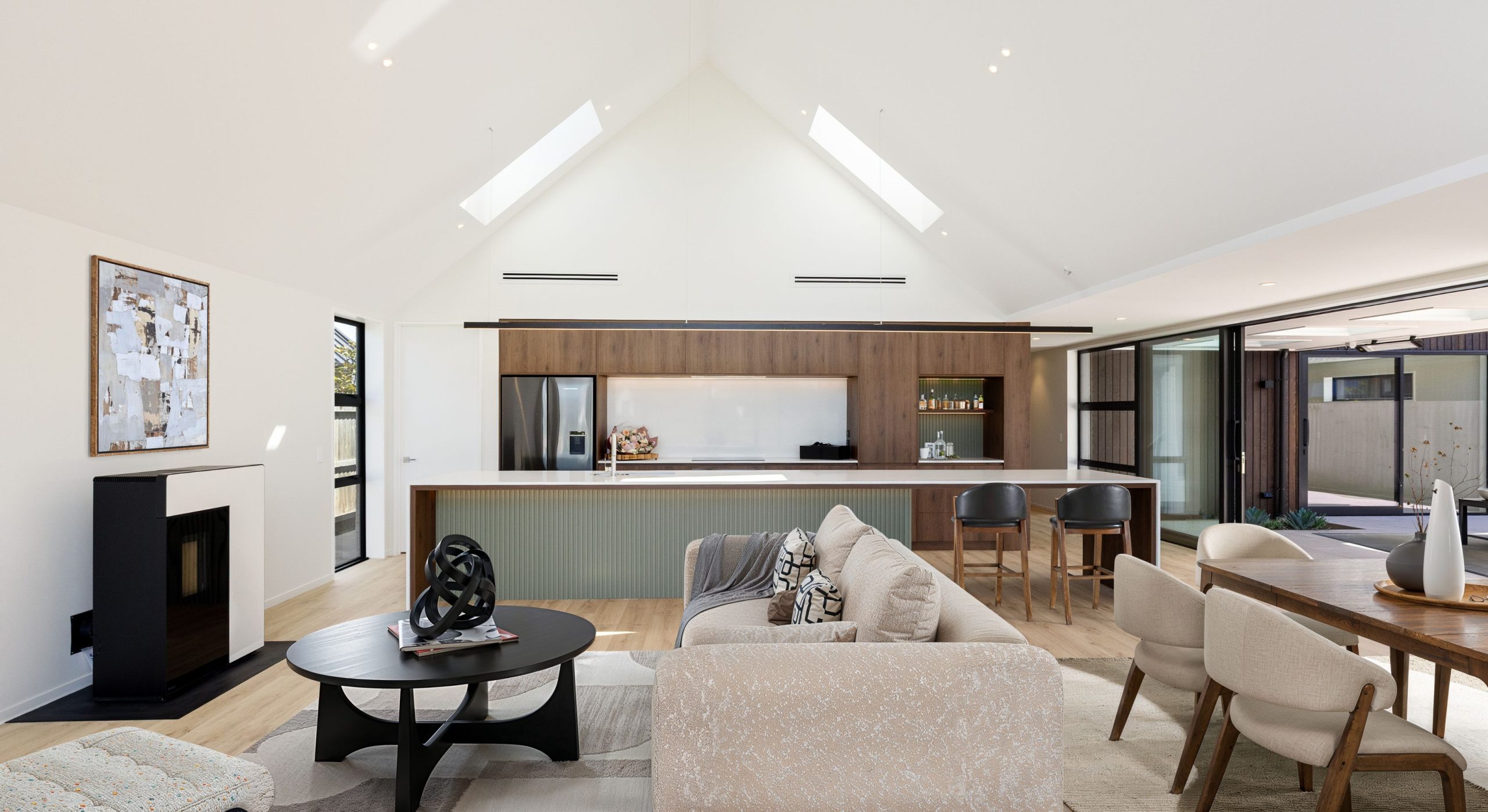 Big kitchen, with earthy tones and attached breakfast bar