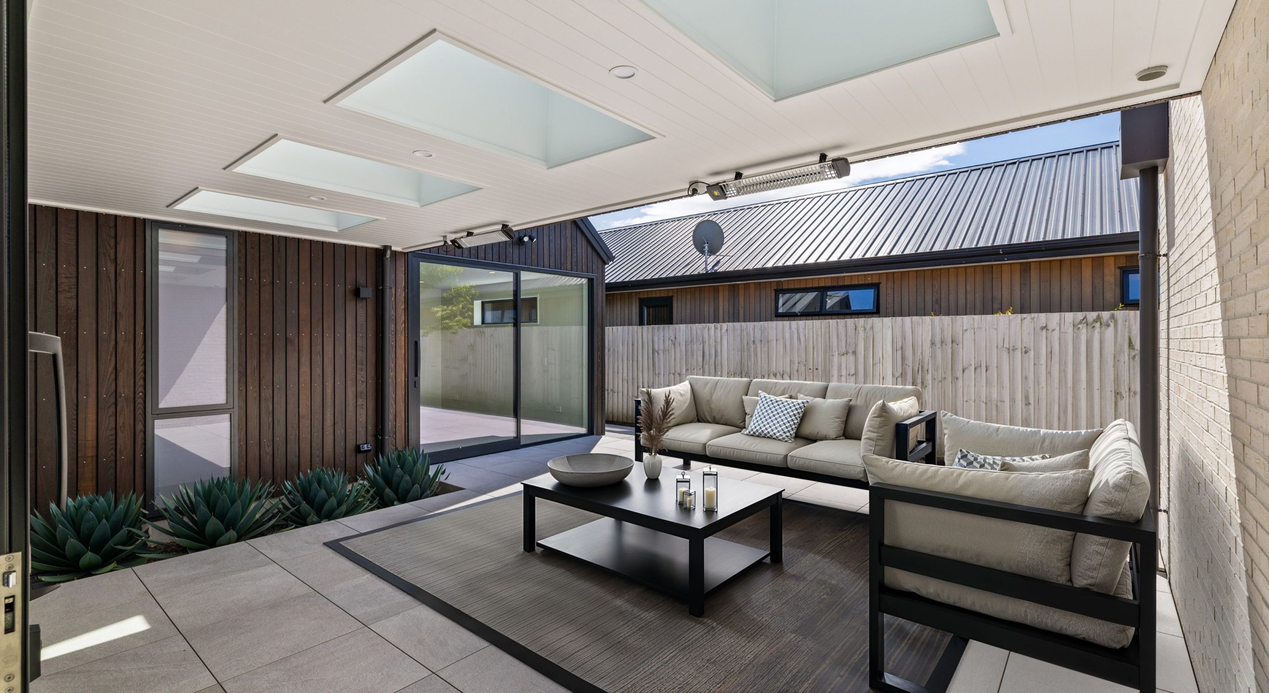 sleek outdoor living with a little garden