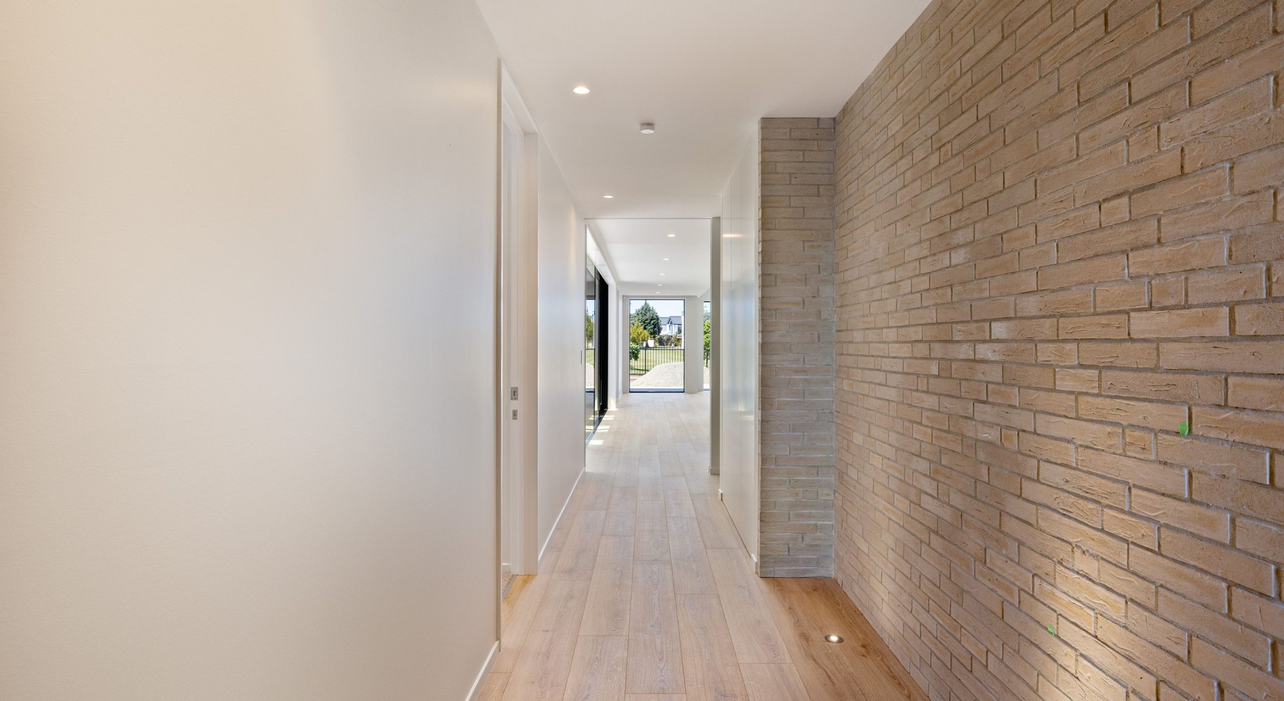 modern house with feature exterior brick inside