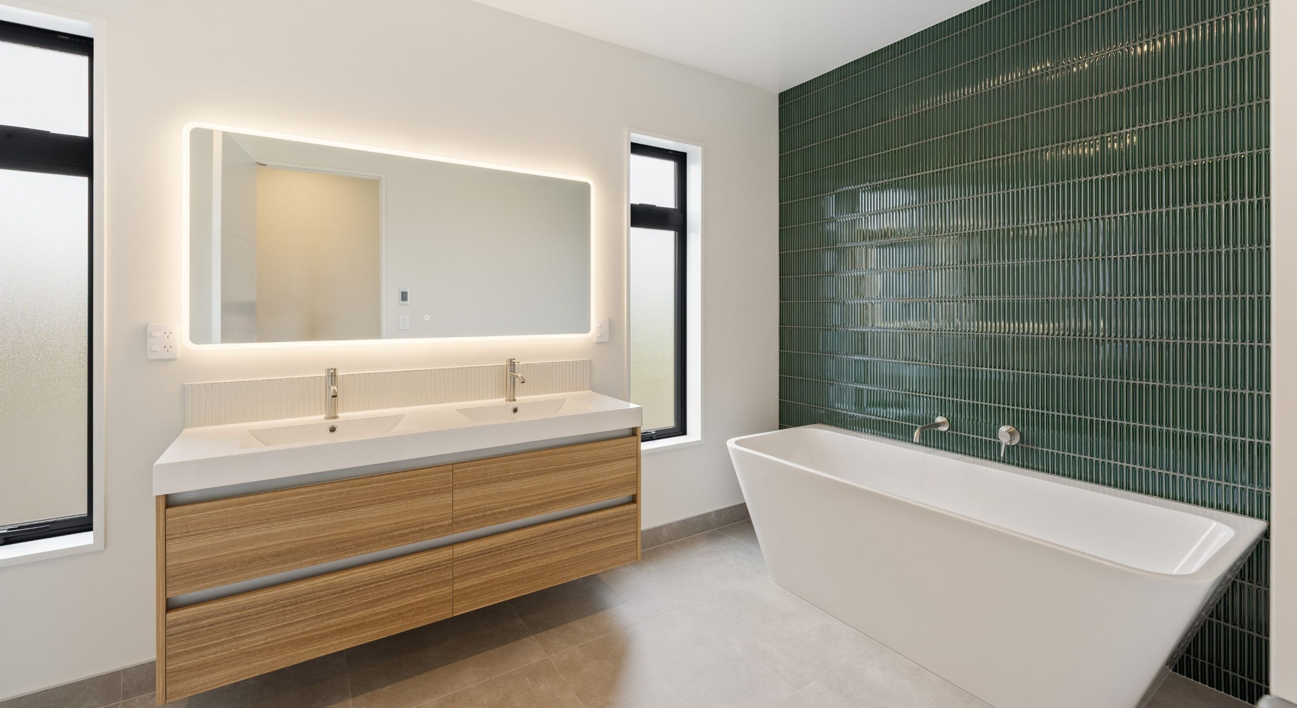 Green fluting tiled bathroom feature wall