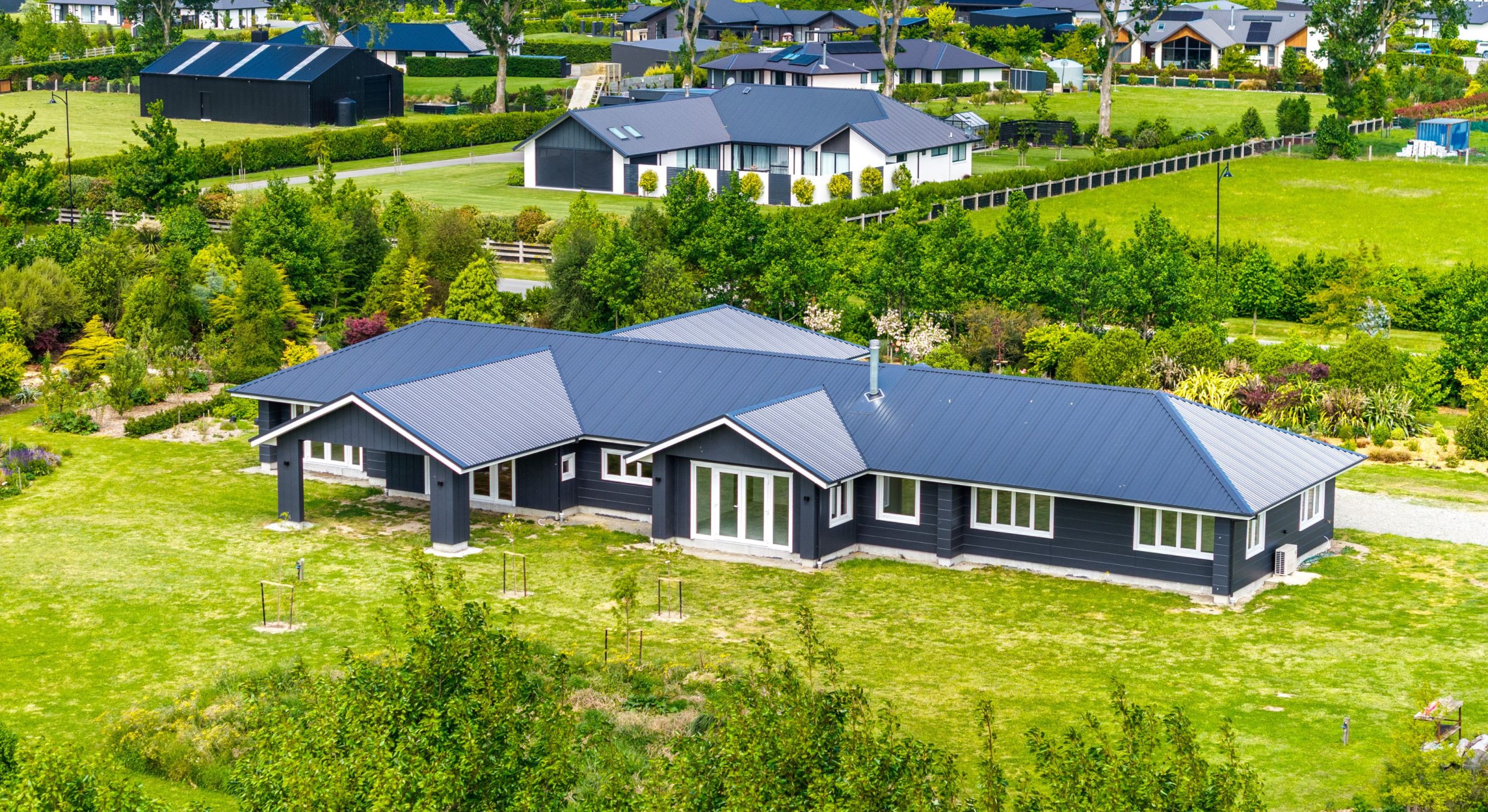 farm house modernized with dark and light features