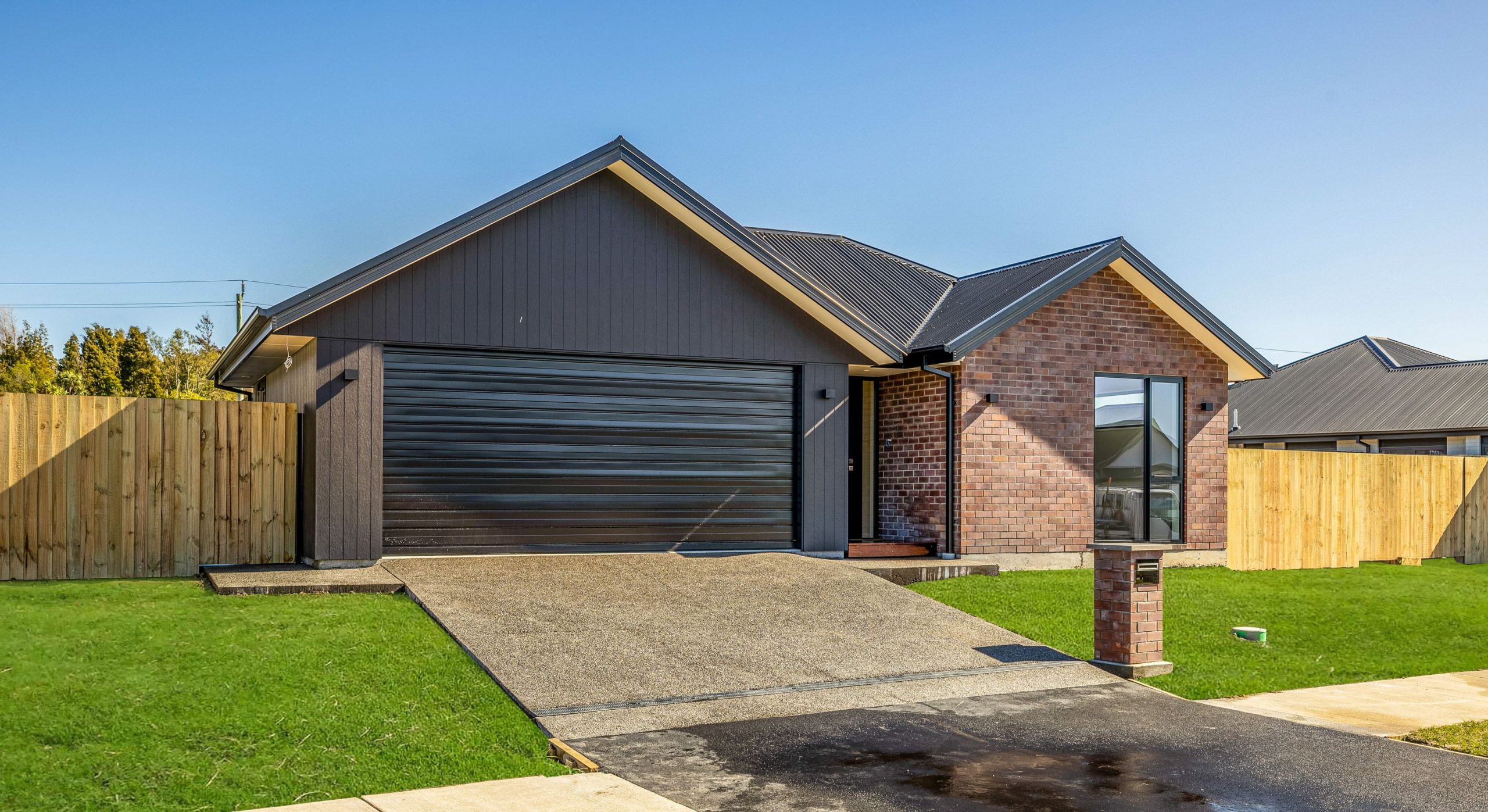 sleek red brick and dark exterior features