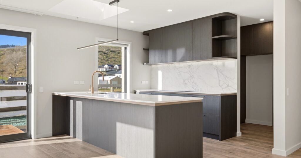 Curved kitchen island with soft rounded lines, a softer layout kitchen trend in a modern Christchurch home