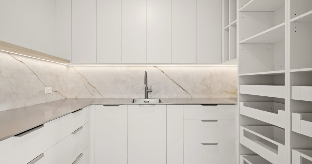 Hidden scullery and butler's pantry behind a custom kitchen, a popular 2026 kitchen trend in Christchurch homes